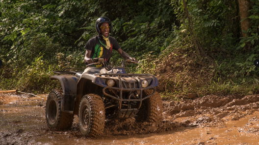 Man in ATV couple throwing a dive to the Secret Blue Hole